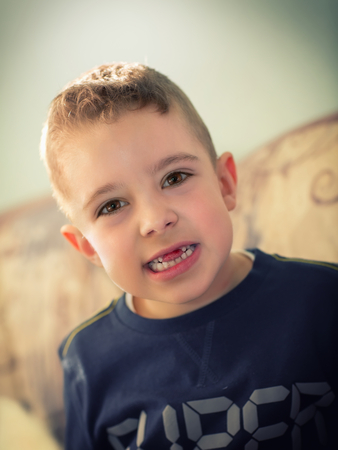 The little boy who has just ripped the front toothの写真素材