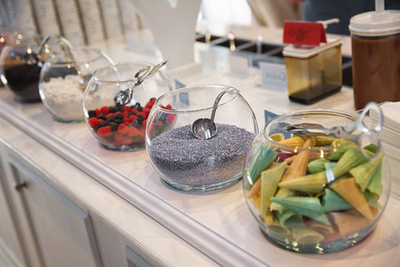 Bowls with candies and treats for decorating various sweet dishes