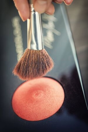 Close up view of different cosmetic brushes for makeup on a dressing tableの写真素材