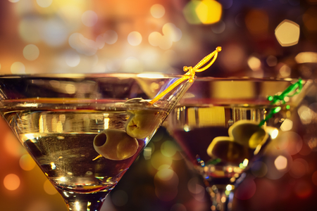 Olive and glass Martini with candle - shallow dofの写真素材