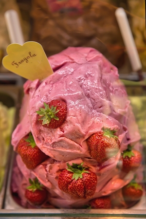 Strawberry ice cream under window shoppingの写真素材