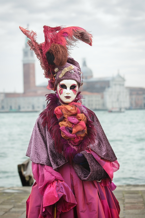 VENICE, ITALY - FEBRUARY 27, 2016: Unidentified person with Venetian Carnival mask in Venice, Italy on February 2016.のeditorial素材