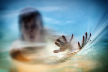 figure of a naked woman behind a transparent curtainの写真素材