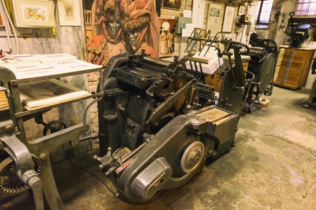 Old print finishing machine in printshop - painting of vintage photoの写真素材