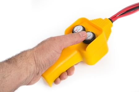 Remote control in hand isolated on white backgroundの写真素材