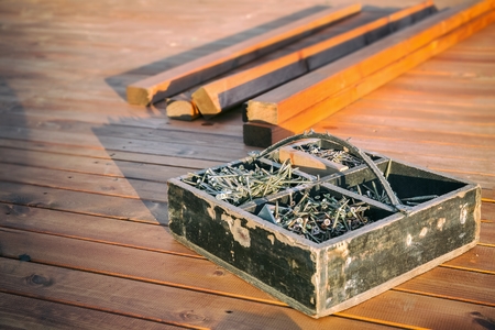 wood screws in a wooden boxの写真素材