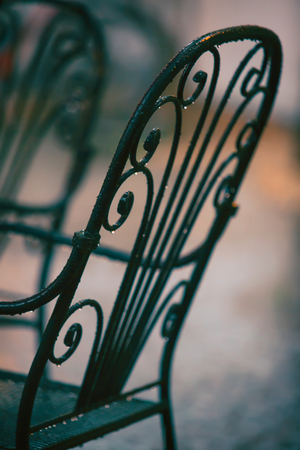 Beautiful old chair in street cafe in Tuscanyの写真素材