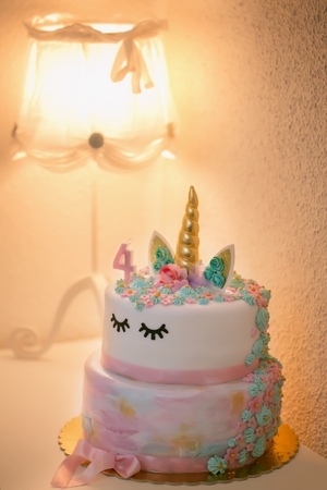 close-up view of delicious birthday cake with number four on topの写真素材
