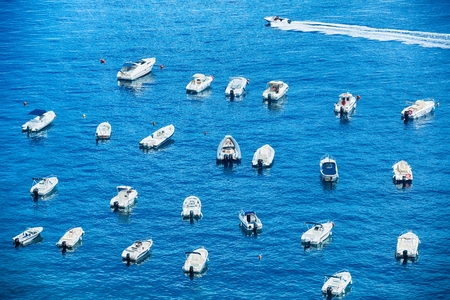 Many different type of small boats at port of Scilla, Calavbria, Italyの写真素材