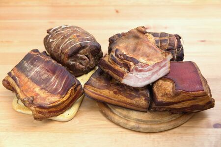 Traditionally smoked meats, ham, sausage, baconの写真素材
