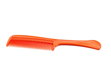 The orange comb on a white background.
