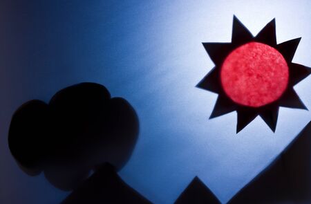 The Shadow of sun and mountains made of recycled paper.の写真素材