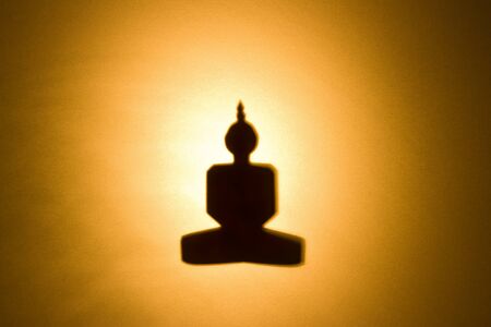 Silhouette of Buddha, made from paper.の写真素材