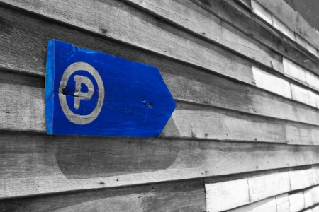 Parking sign on the old wooden wall.の写真素材