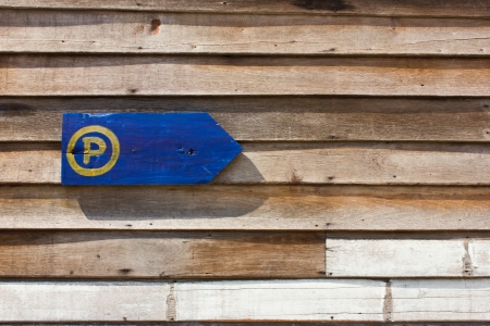 Parking sign on the old wooden wall.の写真素材