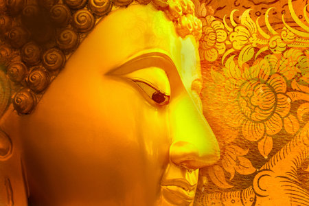 Buddha gold statue on golden background patterns Thailand.の写真素材