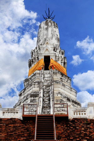 Old white pagoda on blue sky in Thailand.の写真素材