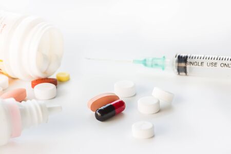 many types of medicines on white background.の写真素材