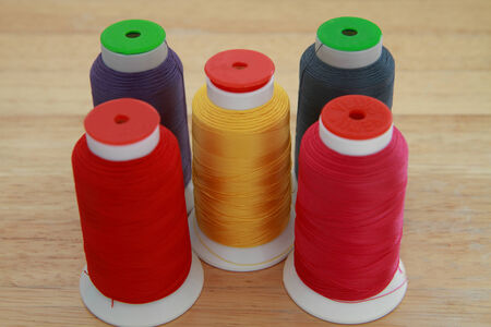 Many colorful thread in spool.
