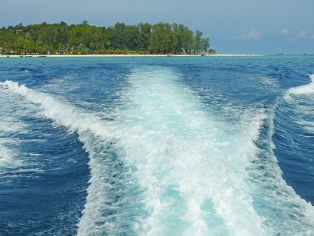 Foamy wake behind the stern of the shipの写真素材
