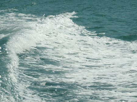 Foamy wake behind the stern of the shipの写真素材