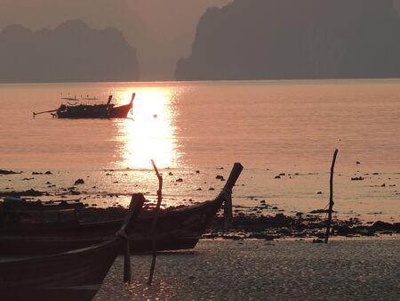 local fishing boat at on sunrise in Phang-Nga,Thailandの写真素材