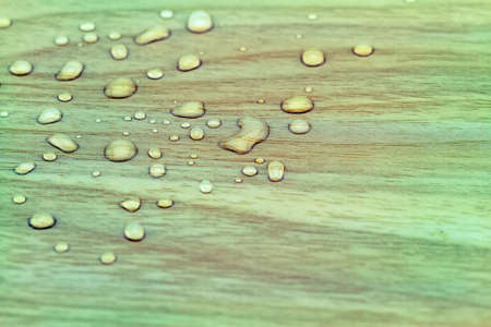 Natural water drops on white woodenの写真素材