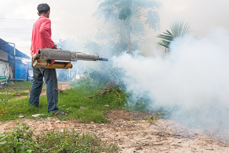 Man Fogging to prevent spread of dengue fever in Thailandの写真素材