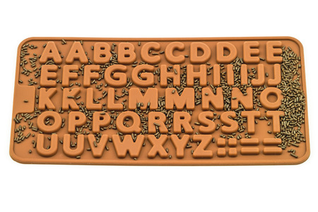 Many chocolate drops in English alphabet on white backgroundの写真素材