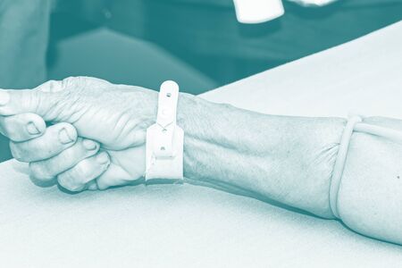 A nurse open intravenous fluid patient for injectionの写真素材