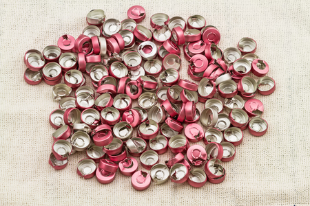 Bottle cap vaccine  aluminum , Aluminium plastic use for prosthetics on  white sack fabric