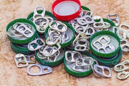 Ring pull aluminum of cans on grunge paper sheet backgroundの写真素材