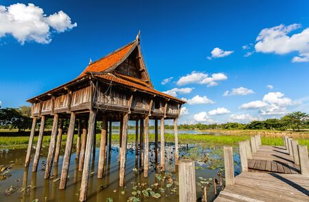 Thai wooden temple architecture on Park NongKhulu in UbonRatchathani province, Thailandのeditorial素材