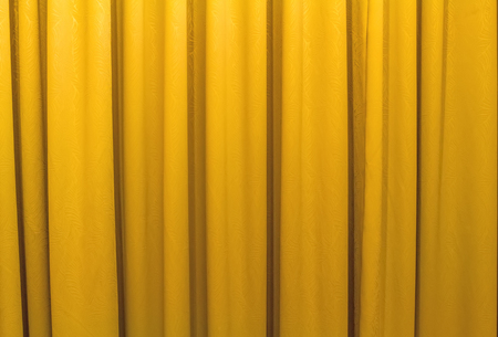 Yellow curtains shading the sunの写真素材