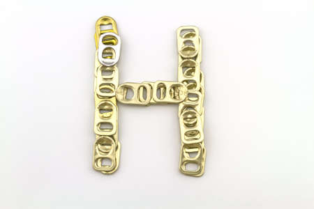 Alphabet  of H stack from  ring pull aluminum of cans on white backgroundの写真素材
