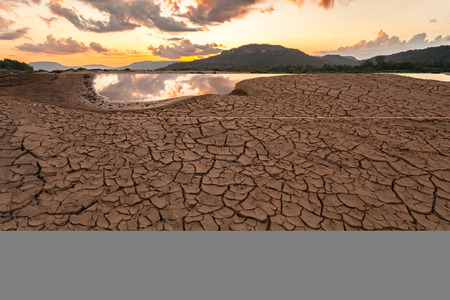 cracked earth near drying water on twilight at at Sam Pan Bok in Mekong river. Ubonratchathani Province ,Thailandの写真素材