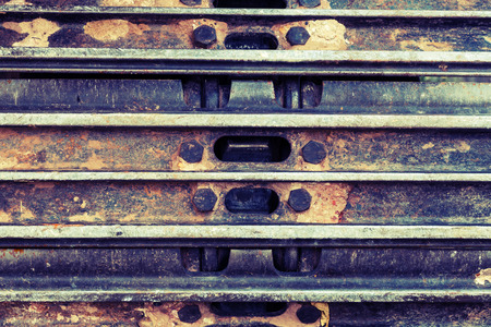 Close up caterpillar tractor fragment and soil backgroundの写真素材
