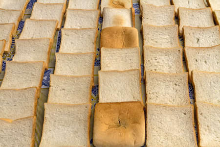 slices of bread on white table on morning light