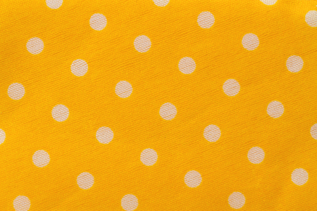 Seamless pattern with big white polka dots on a sunny yellow use a backgroundの写真素材