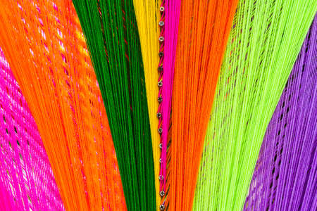 Colorful holy thread crochet pattern, a white string held by Buddhist priests while chanting or put around a house to keep off evil spiritsの写真素材