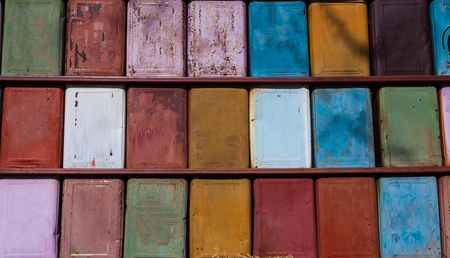 Colorful iron barrel stand on each other
