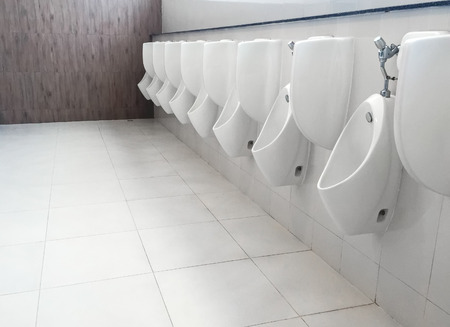 Urinals in public toilet,soft focus