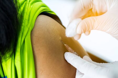 Hand of doctor inject vaccine solution in intradermalの写真素材