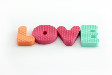 love written in foam letters on white backgroundの写真素材