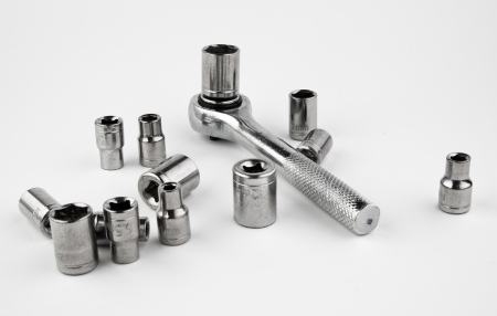 Socket wrench and sockets Ð¾n a white background 