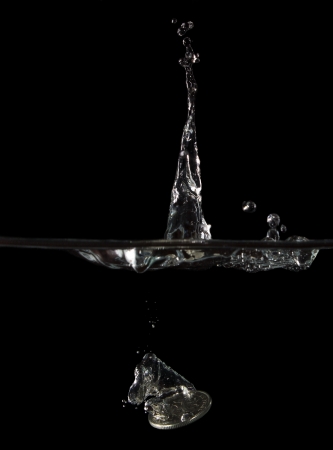Splash of falling coins の写真素材