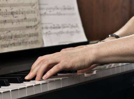Playing the piano  Women s hands close-up の写真素材