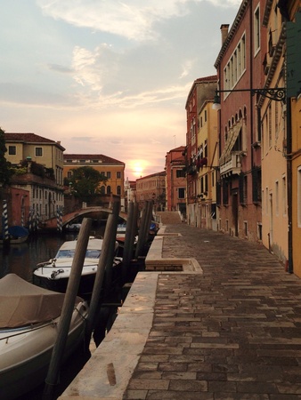 Sunset in Venetian canal after the rain. の素材