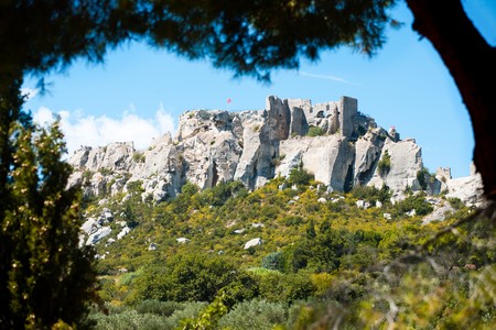 The Chateau de Baux rests precariously on a mountaintop in Les Baux de Provence, France.の写真素材