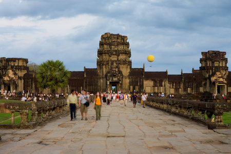 Blurred tourists begin their dawn assault on Angkor Wat Temple in Siem Reap, Cambodiaの写真素材